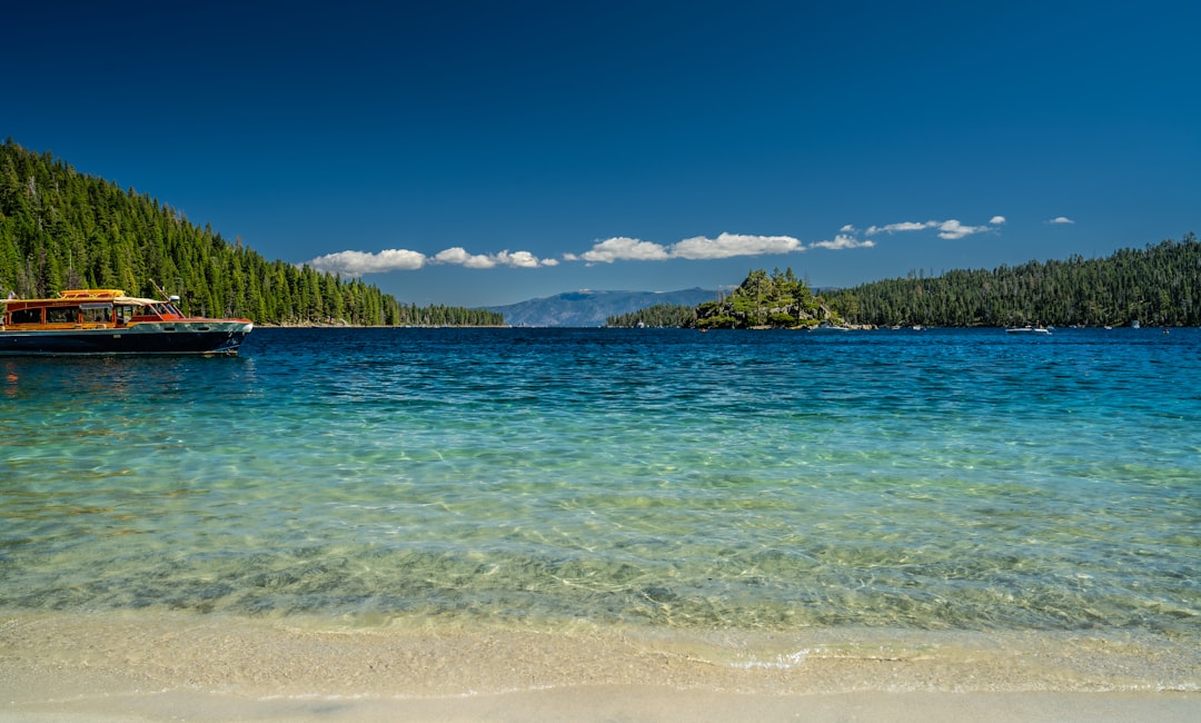 Crystal clear turquoise water laps onto a sandy beach.