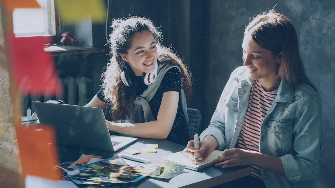 Two women collaborate on a project
