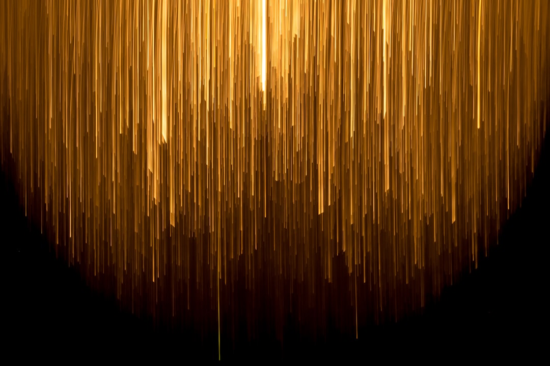 a very long line of yellow lines on a black background