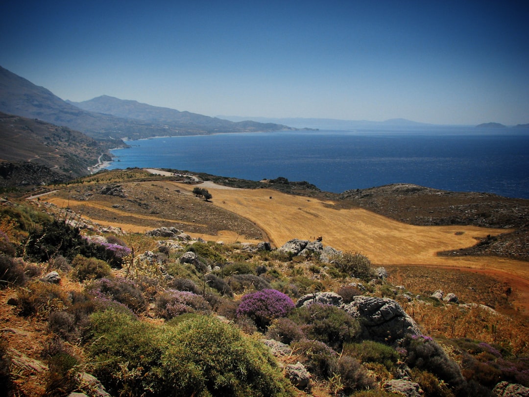 a scenic view of the ocean and mountains